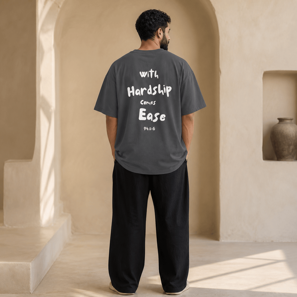 Man wearing the Hardship Comes Ease Grey T-shirt, back view - Ummah Collective