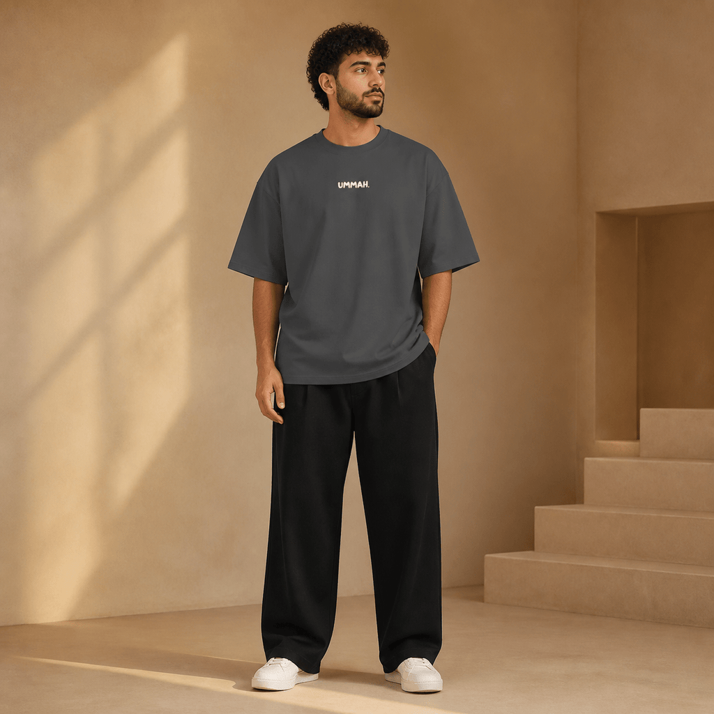 Man wearing the Hardship Comes Ease Grey T-shirt, front view - Ummah Collective